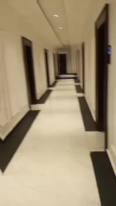 Walking the guest floor — marble corridors, keycard doors